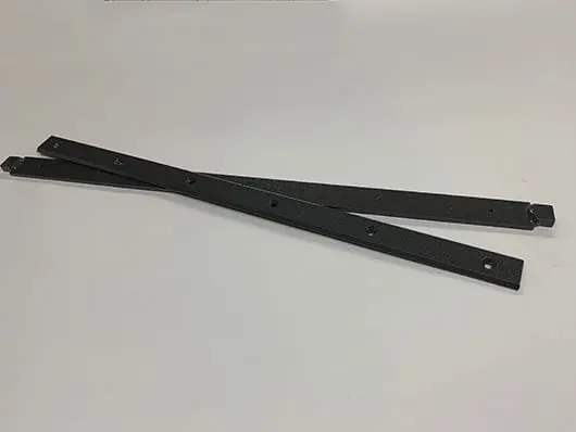 Pair of black metal drawer slides.