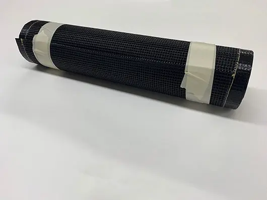 Rolled black mesh wrapped with tape.