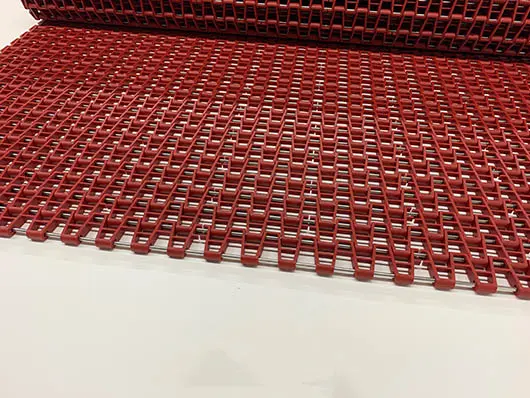 Red plastic conveyor belt system.