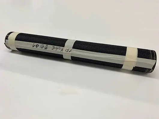 Rolled black mesh with white tape.