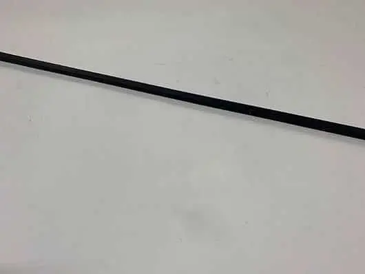 Thin black rod on white background.