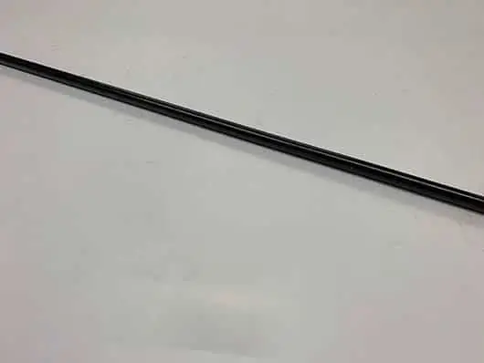 Black stick on a white surface.