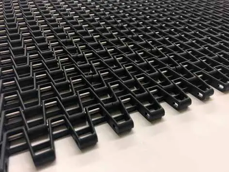Black plastic conveyor belt detail.