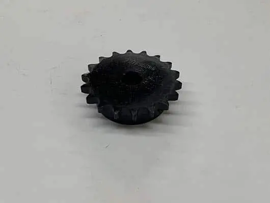 Black plastic gear with hole.