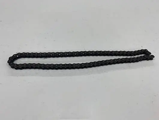 Black metal roller chain component.