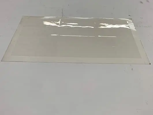 Clear adhesive sheet with grid.