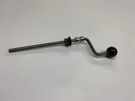 Metal lever with black handle on white.