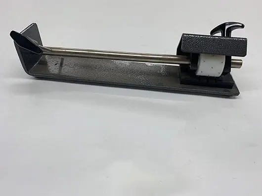 Industrial metal tag applicator machine.