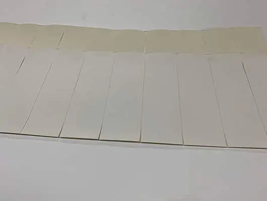 White envelopes arranged in neat rows.