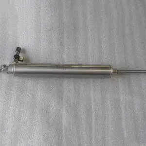Hydraulic cylinder on a textured surface.