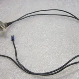 Electrical wires with connectors on textured surface.