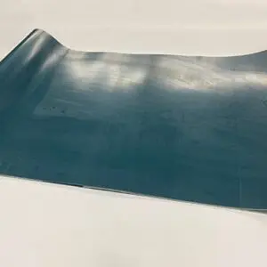 Blue curved metal sheet on white background.