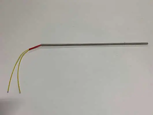 Here's an alt tag for the image: Metal heating element with wires.