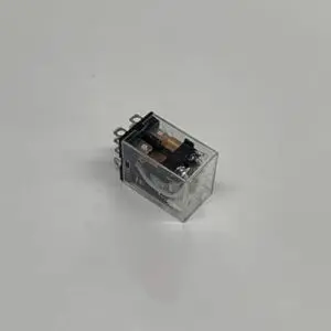 Here's an alt tag for the image: Small transparent relay module.