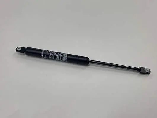 Black gas strut, automotive part.