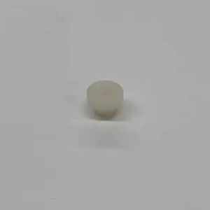 Here's an alt tag for the image: White plastic push-in fastener.