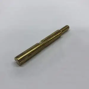 Gold metal rod with notches.