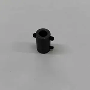 Black cylindrical part with three screws.