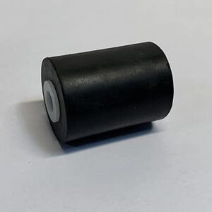 Black cylindrical object on white surface.