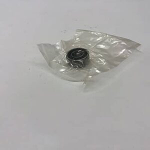 Bearing wrapped in clear plastic on table.