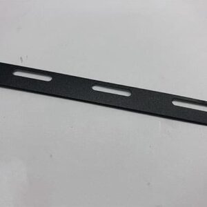 Black metal strip with cutouts.