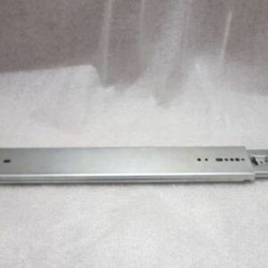 Metal drawer slide on a gray surface.