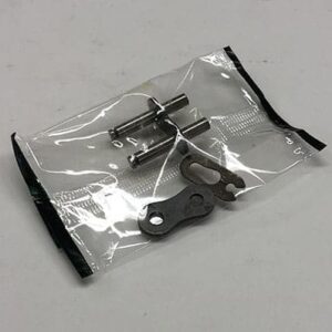 Here's a short alt tag for the image: Motorcycle chain repair kit parts.