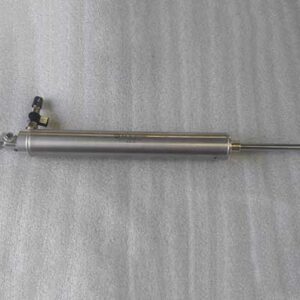 Hydraulic cylinder on a textured surface.
