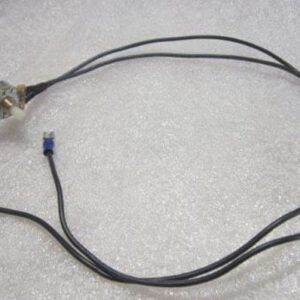 Electrical wires with connectors on textured surface.