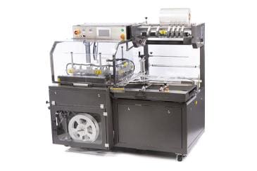 Industrial packaging machine with rollers and controls.