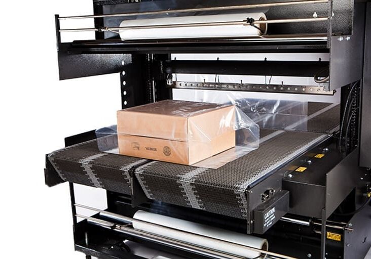 Box on conveyor in packaging machine.